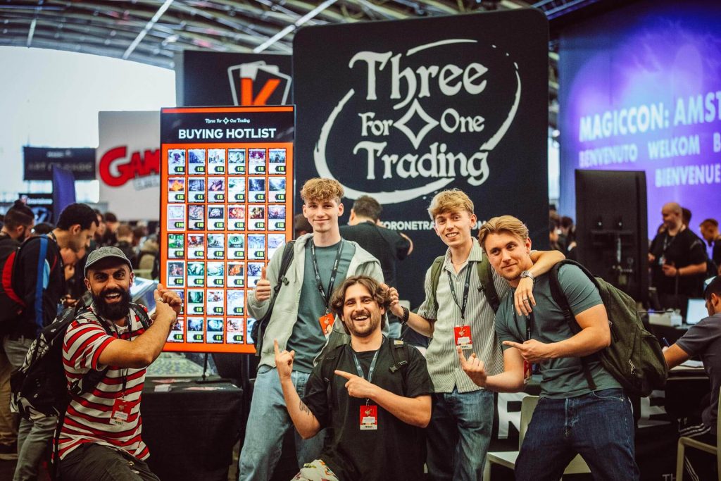 Group picture at the famous Three for One Trading booth